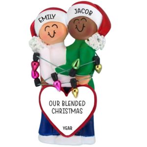 Image of Caucasian Female African American Male Couple Tangled In Lights Ornament