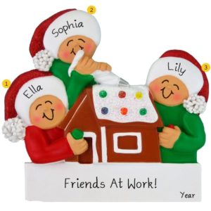 Image of Three Friends Making A Gingerbread House Ornament