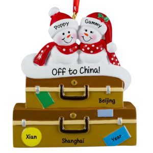 Image of Traveling Grandparents Snow Couple On Suitcase Ornament