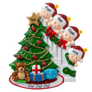 Grandparents With 2 Grandkids On Staircase Peeking At Tree Ornament